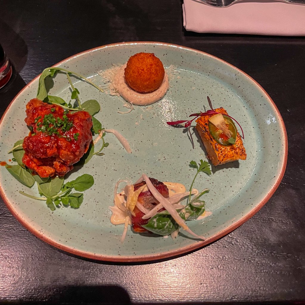 a plate full of appetizer samplers on a Las Vegas food tour