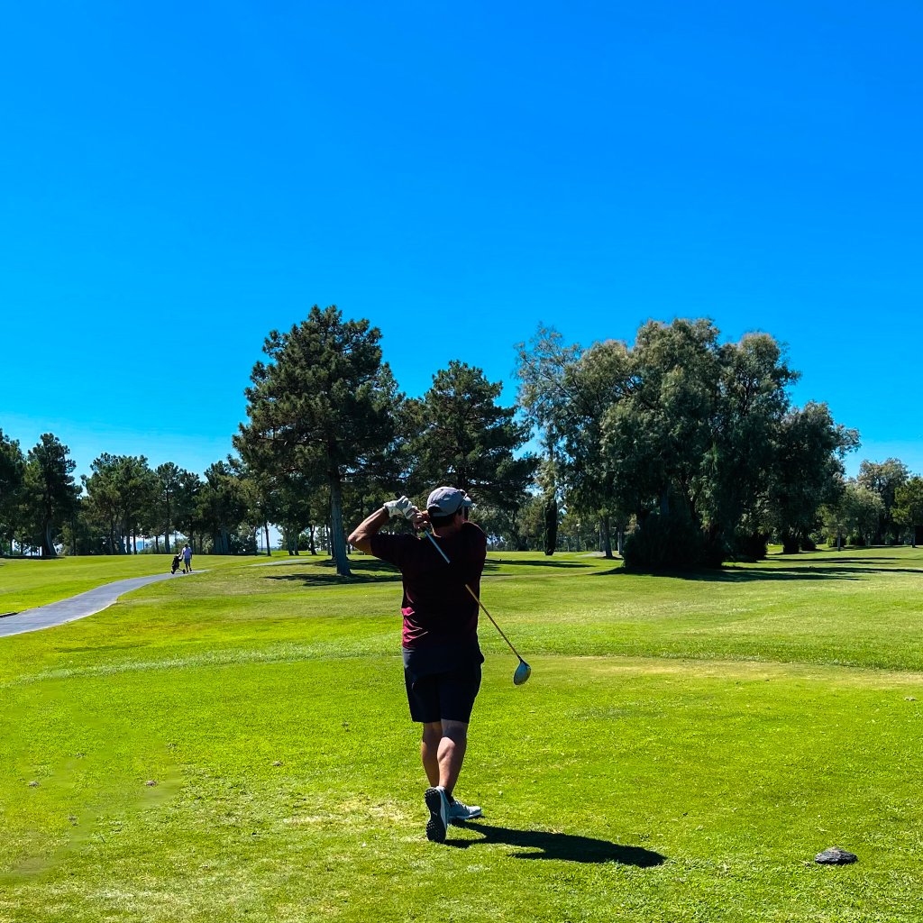 a golfer hitting a ball