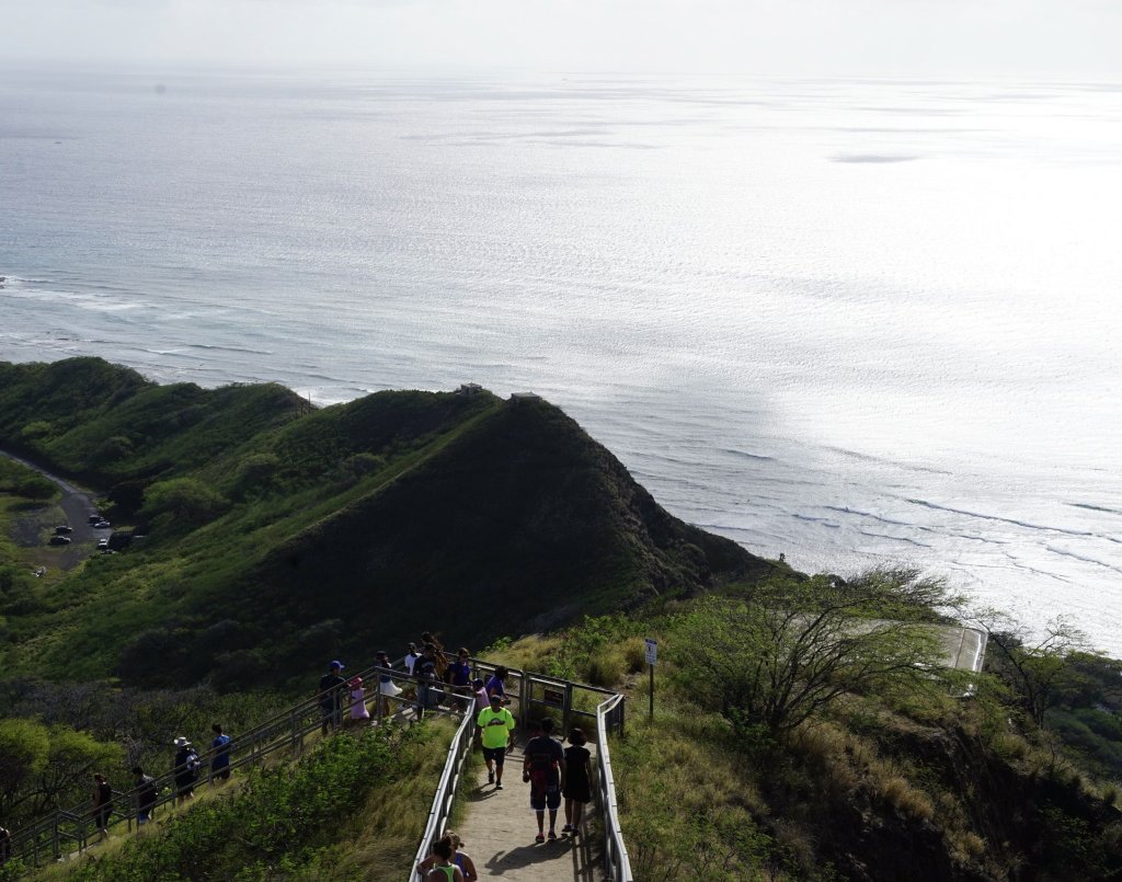 a staircase going up the side of Diamond Head Crater next to the ocean