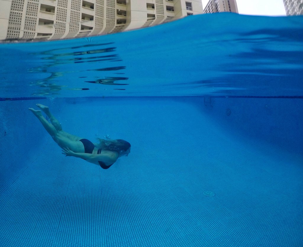 a women swimming in a pool