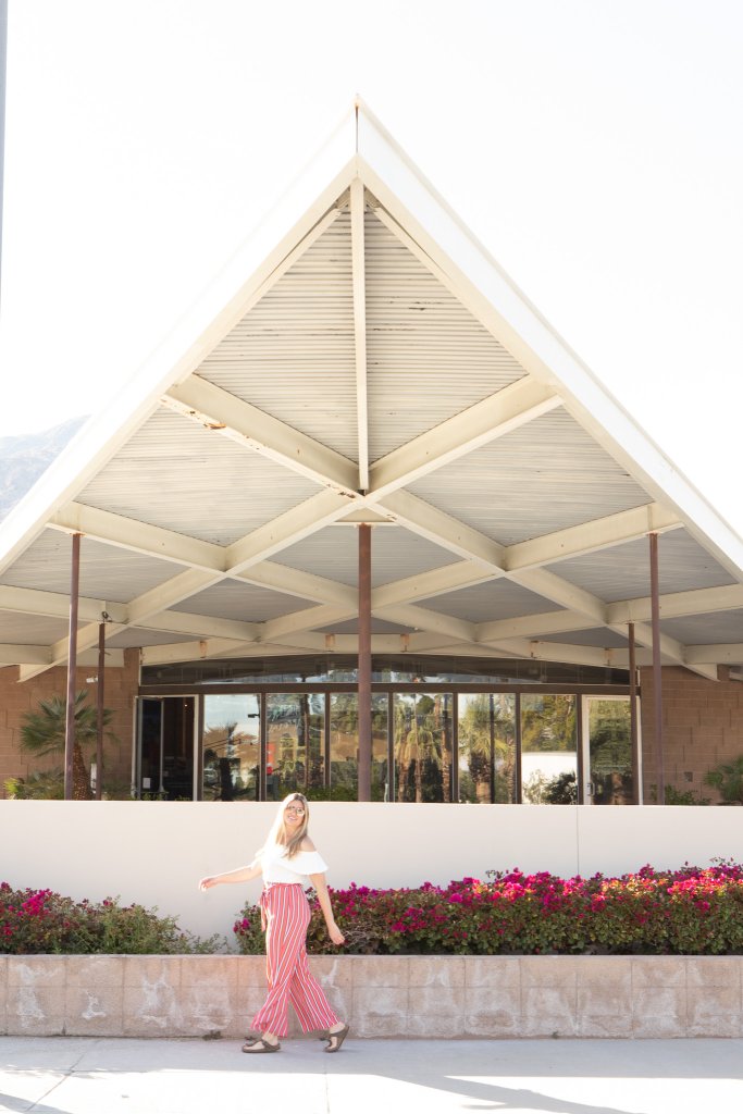 a women walking infront of the Palm's Spring visitor center