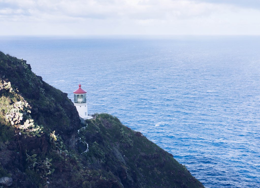 a lighthouse on the ocean edge