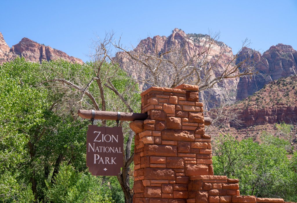 picture of a park sign that says Zion National Park