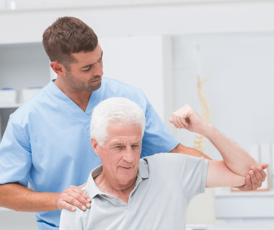 a physical therapist working on a patients arm