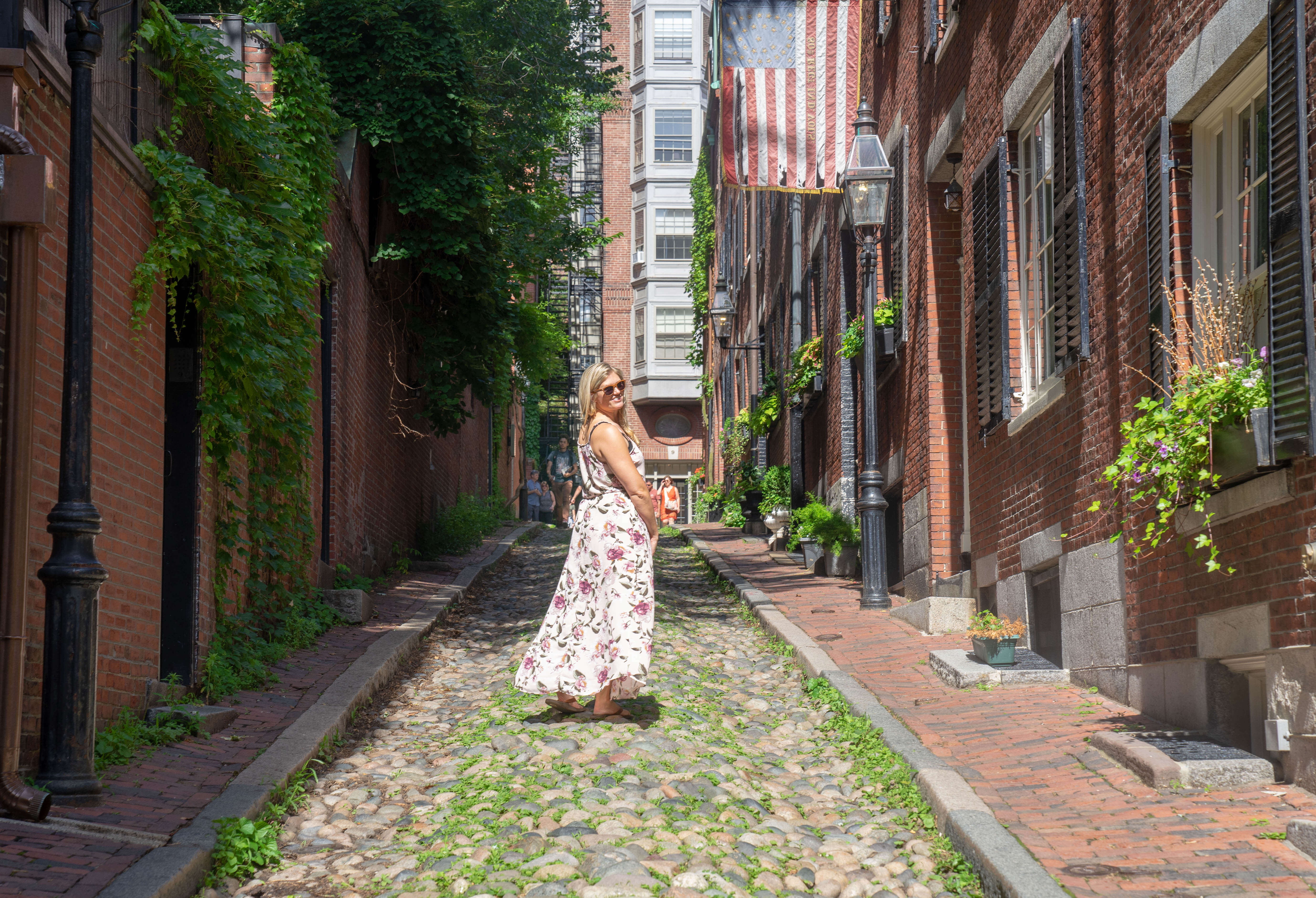 a women standing on acorn street in Boston, MA