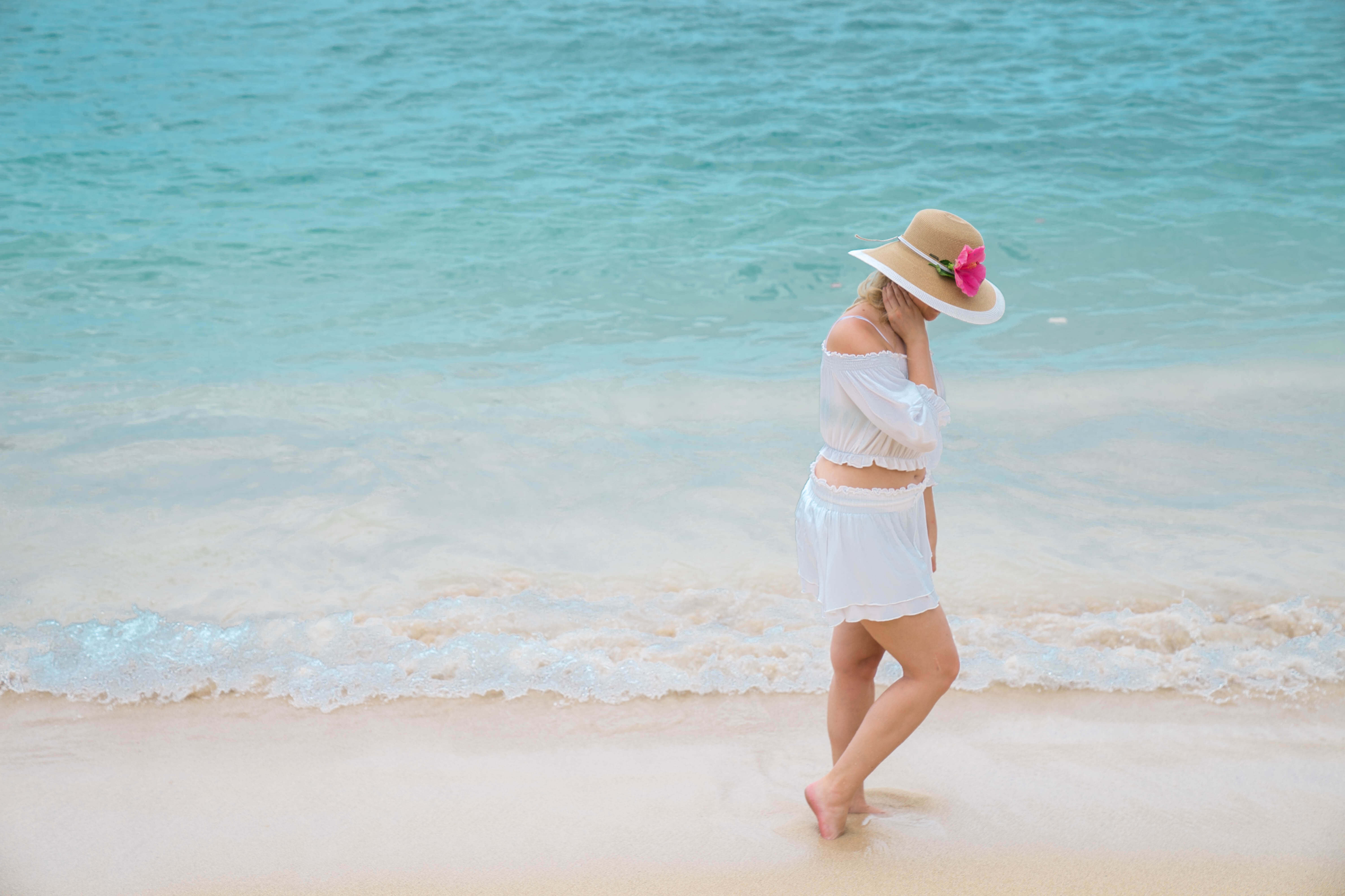 a women walking down Waikiki Beach