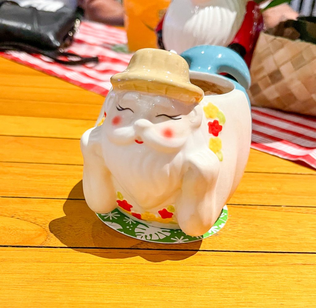 a cup shaped like a Mermaid Santa Claus