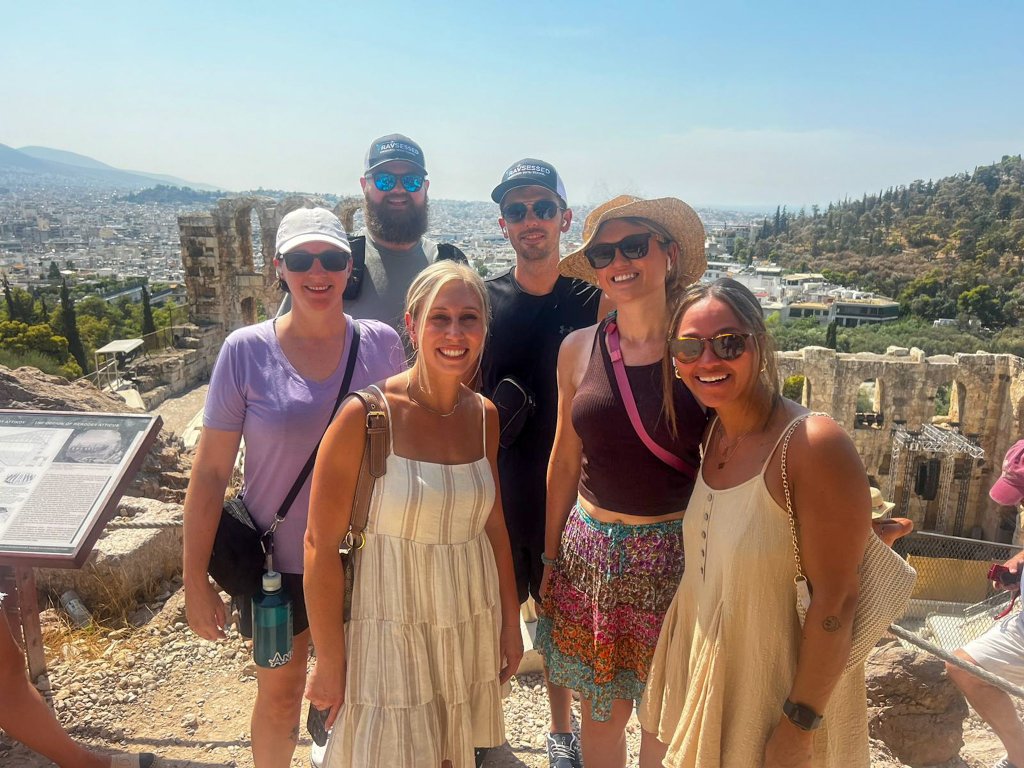 a group standing in Athens Greece