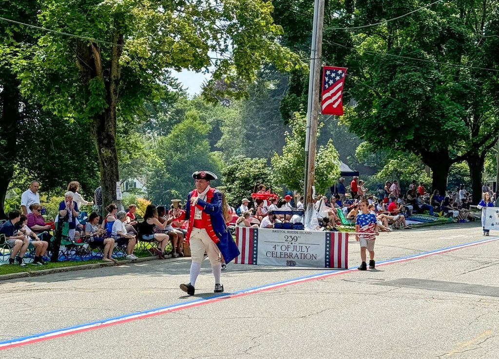 a patriotic walking in the Bristol 4th of July parade