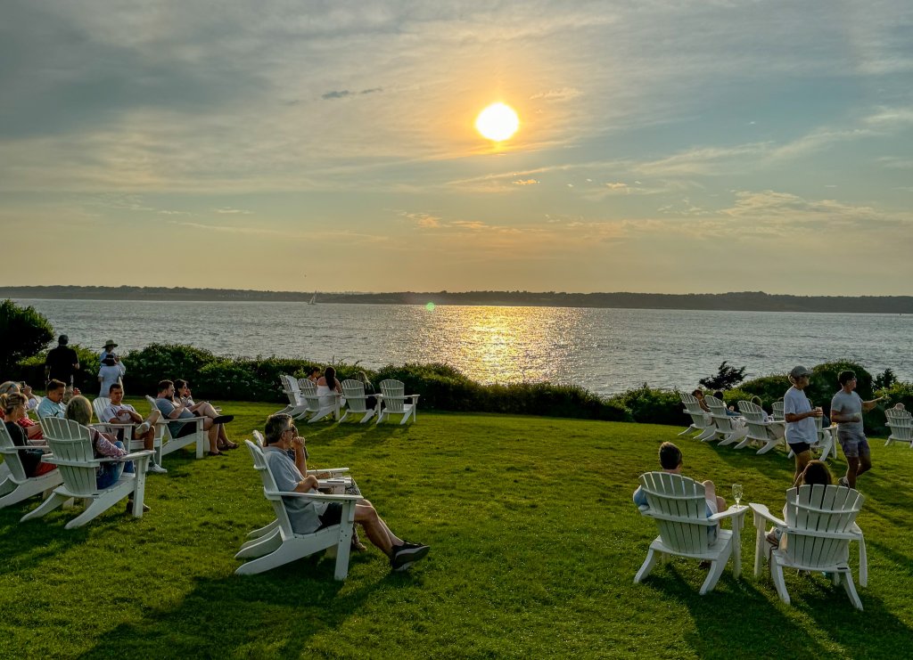 the sunset over The Lawn at Castle Hill Inn